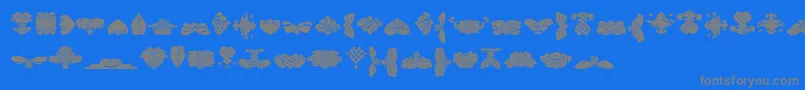 BlackOrnamentsFree-Schriftart – Graue Schriften auf blauem Hintergrund