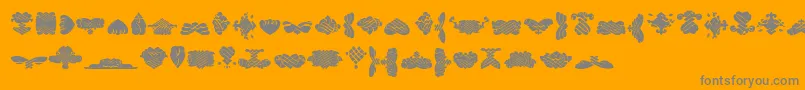 BlackOrnamentsFree-Schriftart – Graue Schriften auf orangefarbenem Hintergrund