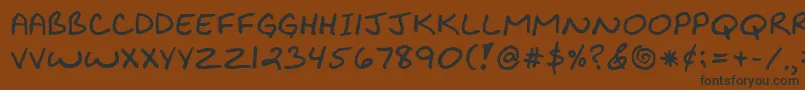 BiklyBold-Schriftart – Schwarze Schriften auf braunem Hintergrund