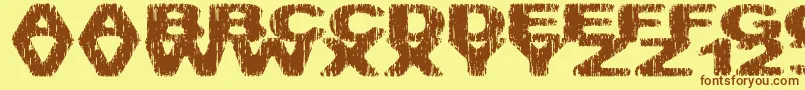フォントHatchetm – 茶色の文字が黄色の背景にあります。