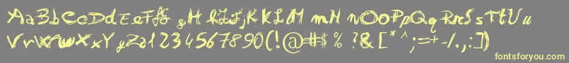 Otrack Font – Yellow Fonts on Gray Background