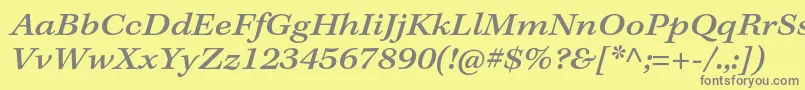 KeplerstdMediumextitcapt-fontti – harmaat kirjasimet keltaisella taustalla