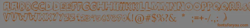 Maniatic Font – Brown Fonts on Gray Background