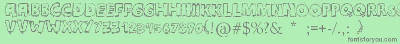 Maniatic Font – Gray Fonts on Green Background