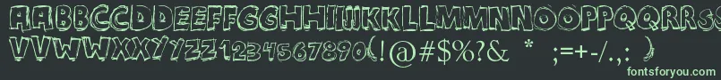 Maniatic Font – Green Fonts on Black Background