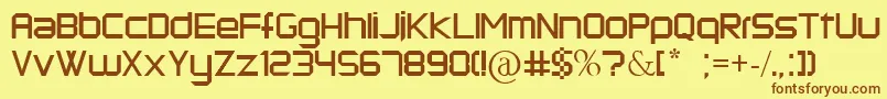フォントKermesse – 茶色の文字が黄色の背景にあります。