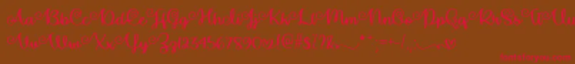 MakeMagicHappenTtf-Schriftart – Rote Schriften auf braunem Hintergrund