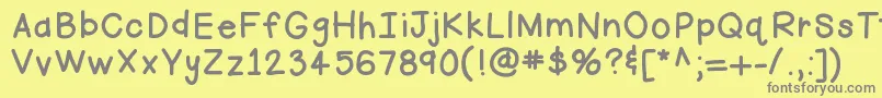 フォントHellofirstie – 黄色の背景に灰色の文字