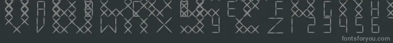 フォントEmbroidV01 – 黒い背景に灰色の文字