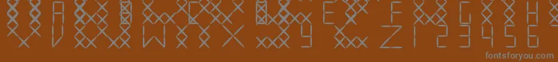 EmbroidV01 Font – Gray Fonts on Brown Background
