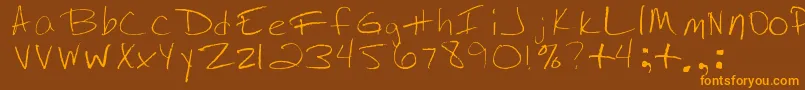 フォントJennysHandwriting – オレンジ色の文字が茶色の背景にあります。