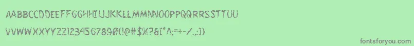 Flesheatingcond Font – Gray Fonts on Green Background