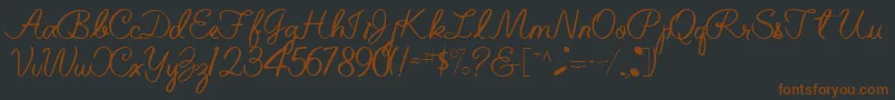 Fonte BelindaRegularTtnorm – fontes marrons em um fundo preto