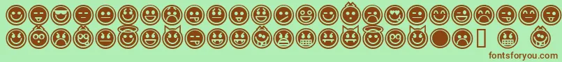 Czcionka EmoticonsOutline – brązowe czcionki na zielonym tle