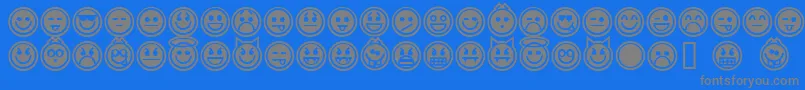 Czcionka EmoticonsOutline – szare czcionki na niebieskim tle