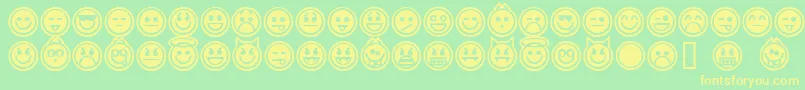 Czcionka EmoticonsOutline – żółte czcionki na zielonym tle