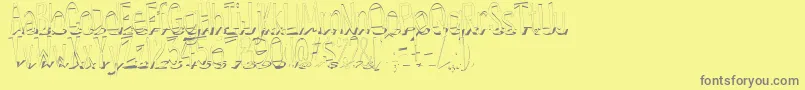 フォントHesitantShadow – 黄色の背景に灰色の文字