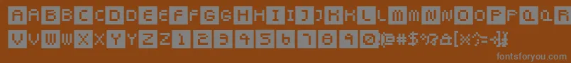 Fonte Pixeltwist – fontes cinzas em um fundo marrom