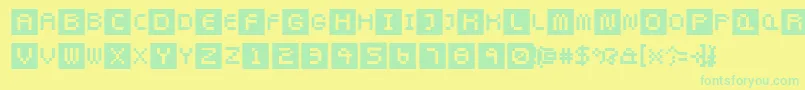 Pixeltwist-Schriftart – Grüne Schriften auf gelbem Hintergrund