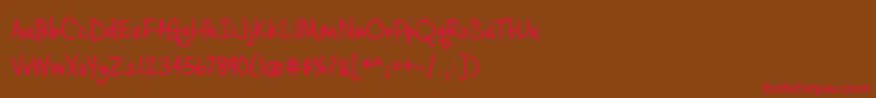 フォントCashewAppleAleBold – 赤い文字が茶色の背景にあります。
