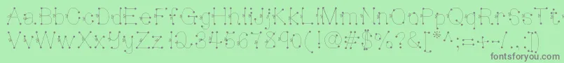 Czcionka Deedeesquigglesandties – szare czcionki na zielonym tle