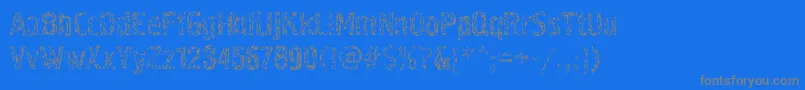 Pollockc4-fontti – harmaat kirjasimet sinisellä taustalla
