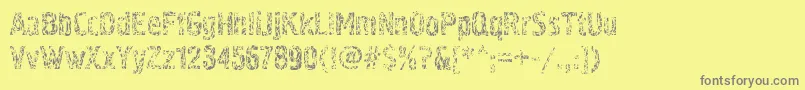 Pollockc4-fontti – harmaat kirjasimet keltaisella taustalla