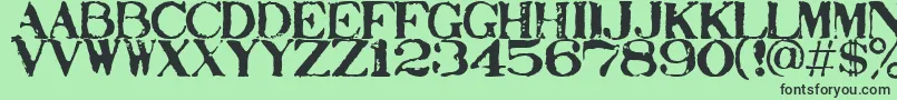 フォントStampact – 緑の背景に黒い文字