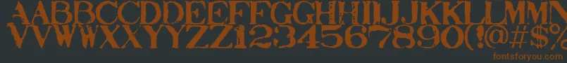 Stampact-fontti – ruskeat fontit mustalla taustalla