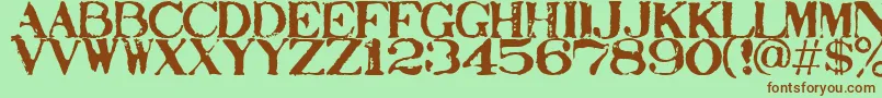 Stampact Font – Brown Fonts on Green Background