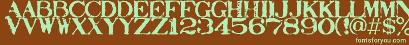 Stampact Font – Green Fonts on Brown Background