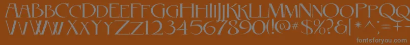 RebelCaps2010-fontti – harmaat kirjasimet ruskealla taustalla
