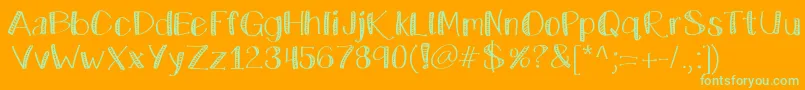 Katecelebration-Schriftart – Grüne Schriften auf orangefarbenem Hintergrund