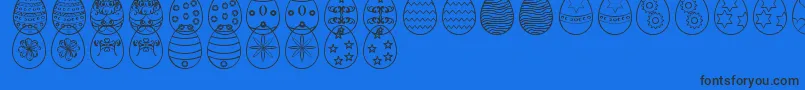 EasterEggsSt-Schriftart – Schwarze Schriften auf blauem Hintergrund