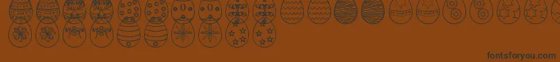 Шрифт EasterEggsSt – чёрные шрифты на коричневом фоне