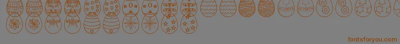 EasterEggsSt-Schriftart – Braune Schriften auf grauem Hintergrund