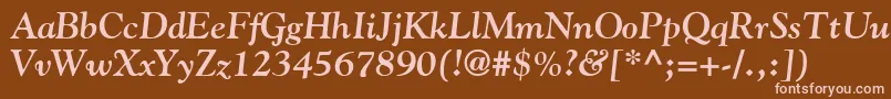 GoudyBoldItalic-fontti – vaaleanpunaiset fontit ruskealla taustalla