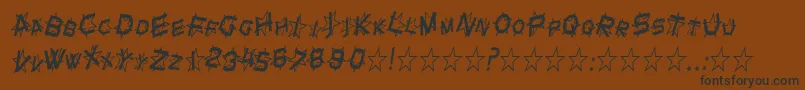 SfStarDustCondensedItalic-Schriftart – Schwarze Schriften auf braunem Hintergrund