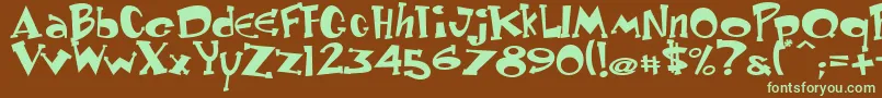 フォントKeyster – 緑色の文字が茶色の背景にあります。