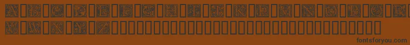 フォントGoudyini – 黒い文字が茶色の背景にあります