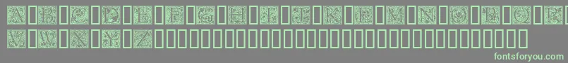 Goudyini-Schriftart – Grüne Schriften auf grauem Hintergrund