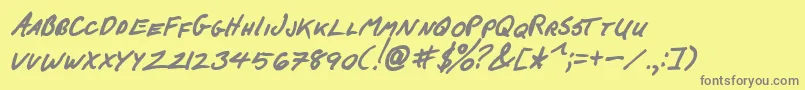 FCkBeansBoldItalic-fontti – harmaat kirjasimet keltaisella taustalla