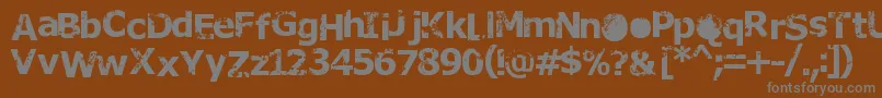 Rusto-fontti – harmaat kirjasimet ruskealla taustalla