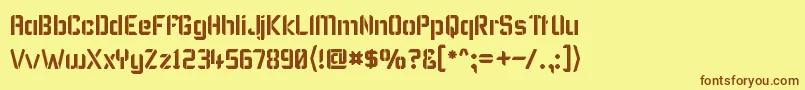 フォントKarismas – 茶色の文字が黄色の背景にあります。