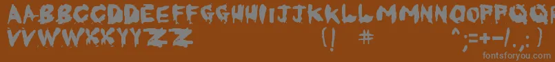フォントKornnetTooItTalitm – 茶色の背景に灰色の文字