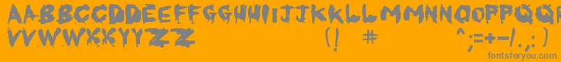 KornnetTooItTalitm-fontti – harmaat kirjasimet oranssilla taustalla