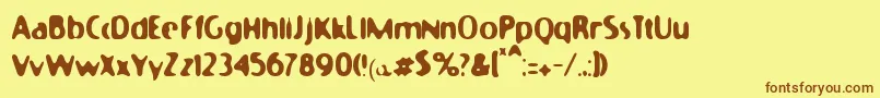 フォントMoonycat – 茶色の文字が黄色の背景にあります。