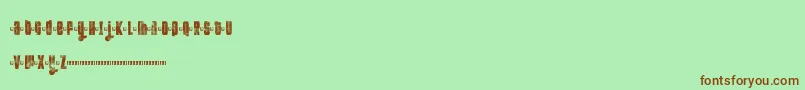 Czcionka Ftkolari – brązowe czcionki na zielonym tle