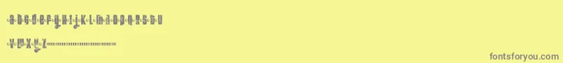 Fonte Ftkolari – fontes cinzas em um fundo amarelo