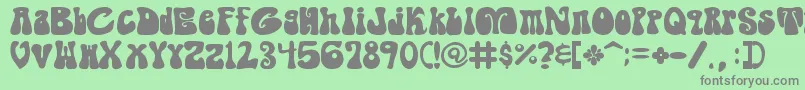 フォントShagade – 緑の背景に灰色の文字